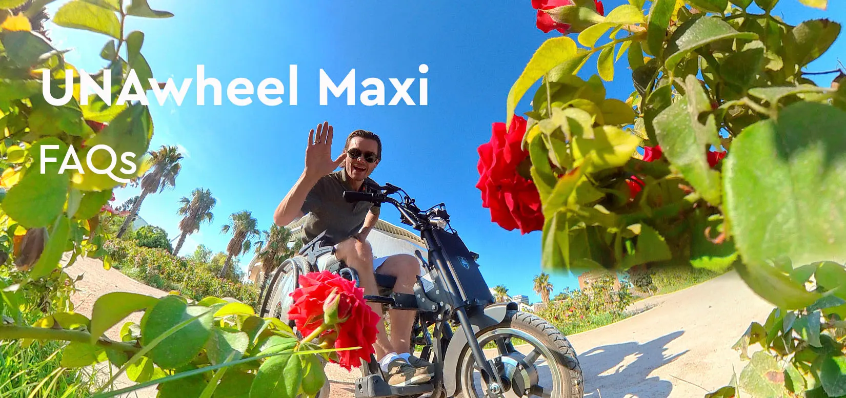 Пользователь UNAwheel Maxi на прогулке приветственно машет рукой